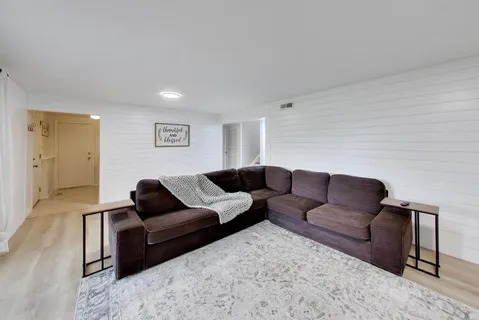 a living room with furniture and a couch