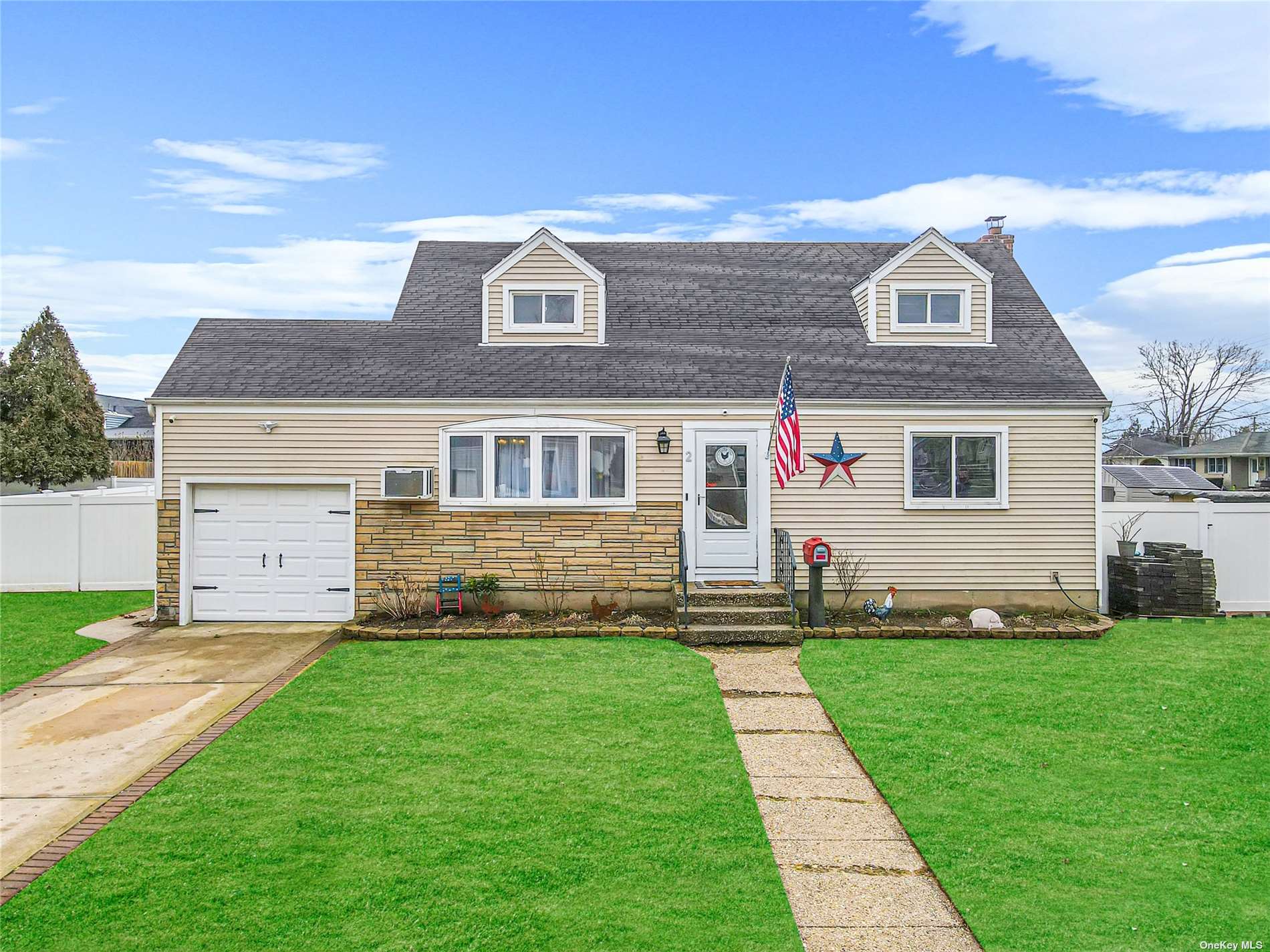 2 Clark Street West Babylon, NY 11704 - Photo 1 of 1 a front view of a house with a yard