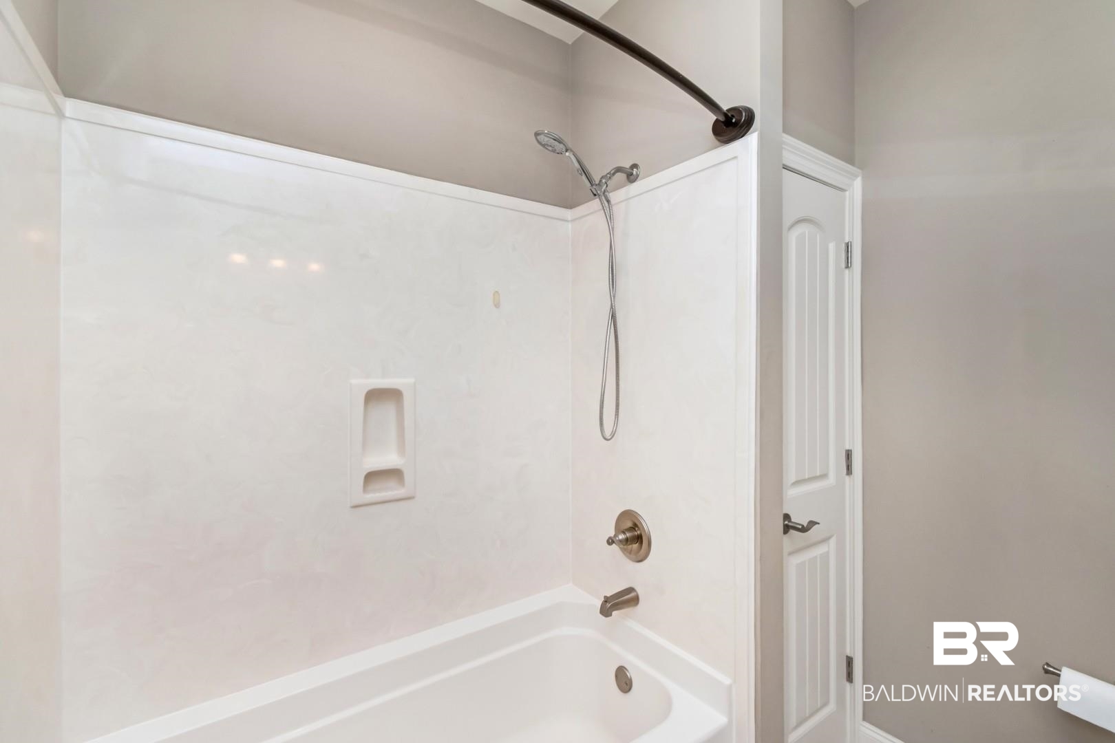 3528 Rue Royal Mobile, AL 36693 - Photo 37 of 53 White tub and shower combination with an integrated soap dish and brushed nickel fixtures