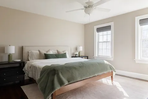 a bedroom with a bed and window