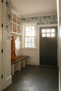 a room that has a window and a wooden floor