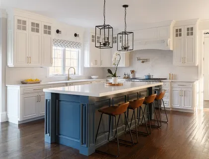 a kitchen with a sink stove and wooden floor