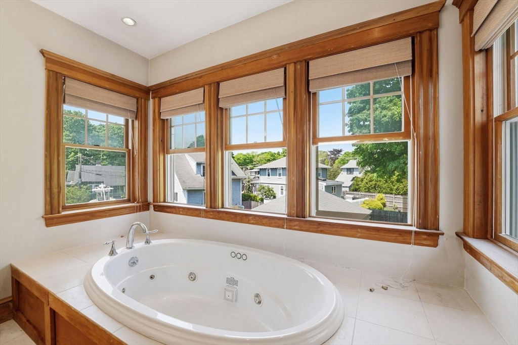 19 Humphrey Street Marblehead, MA 01945 - Photo 21 of 29 a bathroom with a bathtub and windows