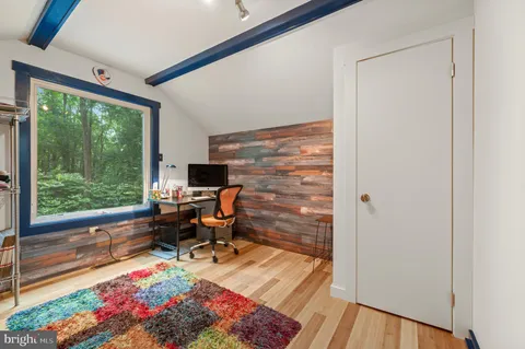 a workspace with furniture and a window