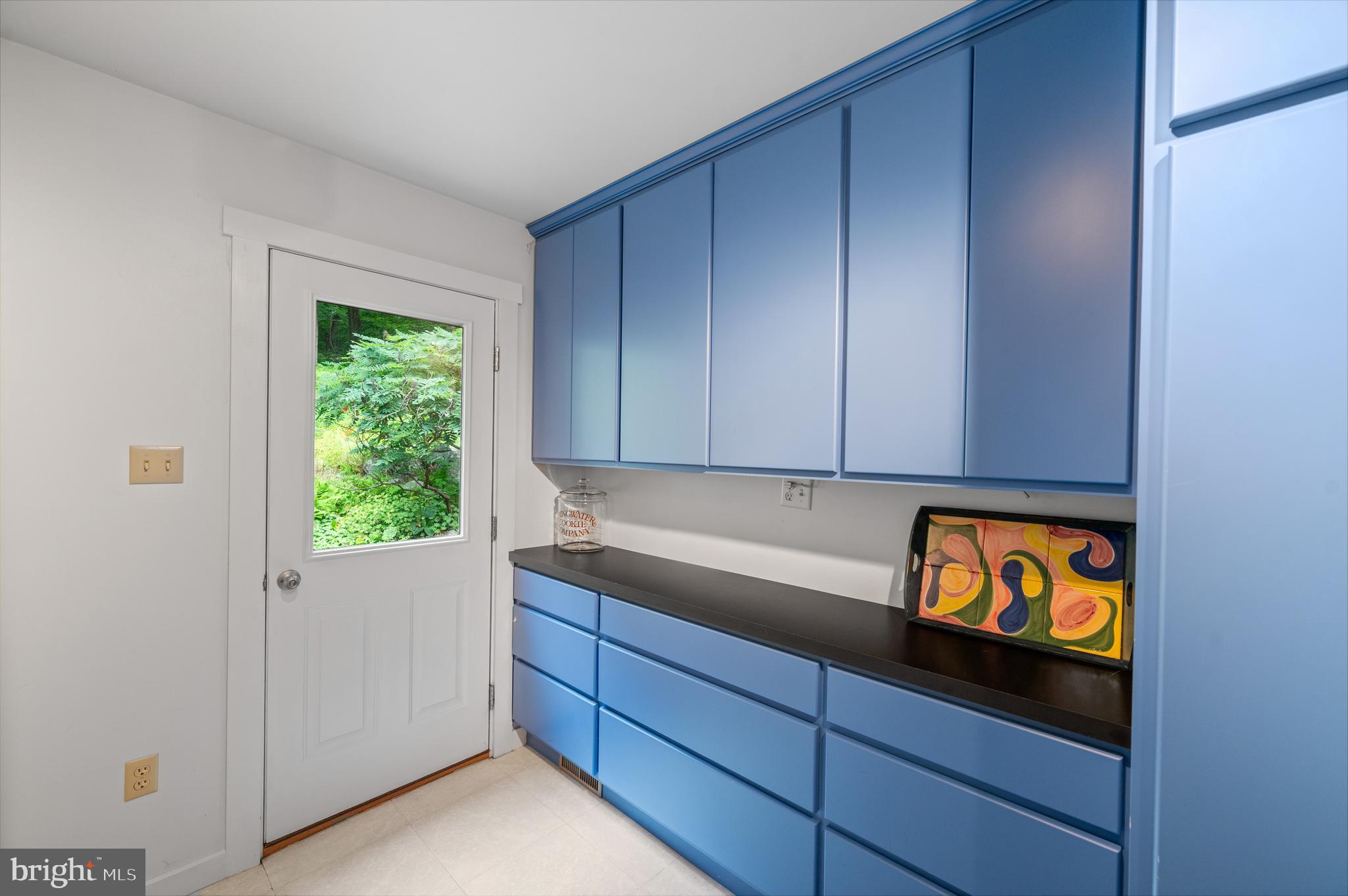 41 Lyons Run Road Glenmoore, PA 19343 - Photo 36 of 42 a kitchen with granite countertop wooden cabinets and a sink
