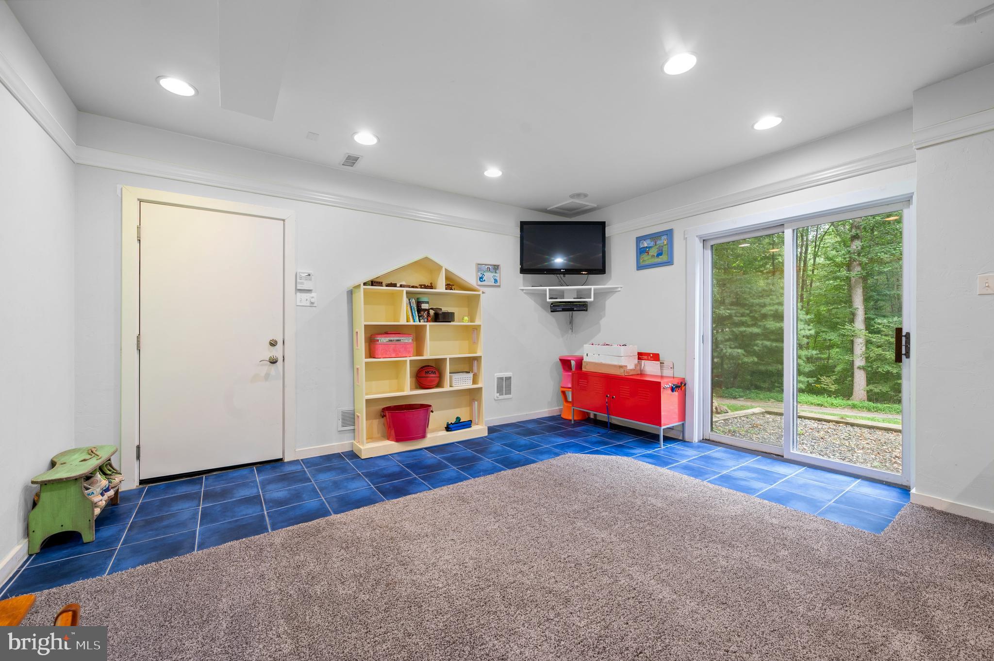 41 Lyons Run Road Glenmoore, PA 19343 - Photo 41 of 42 a living room with furniture and a flat screen tv