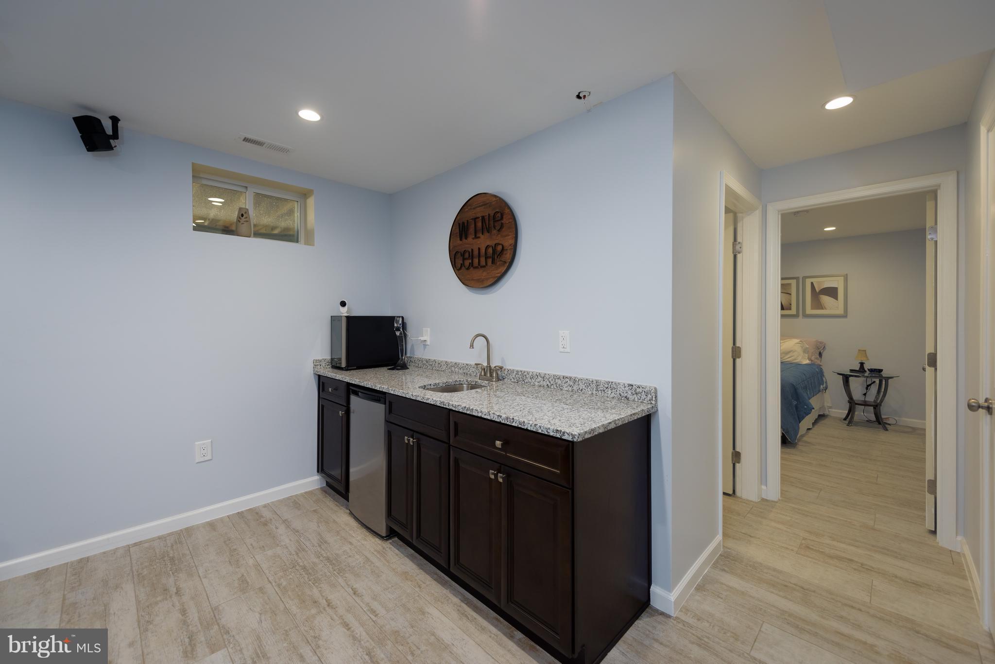 8104 Ridgely Loop Severn, MD 21144 - Photo 25 of 30 Lower Level Family/Recreation Room Wet Bar