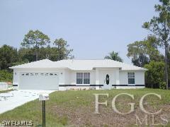 9091 Henry Road Fort Myers, FL 33967 - Photo 1 of 1 a front view of a house with a yard