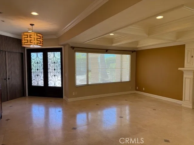 a view of an empty room with glass door