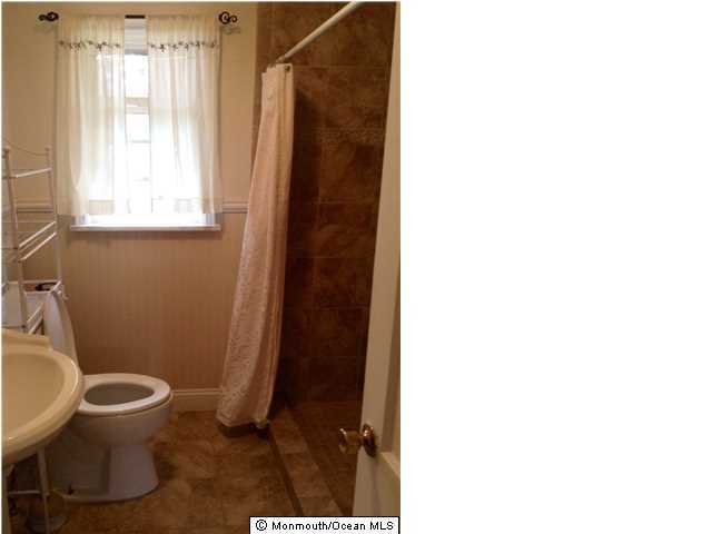 804 Allaire Road Spring Lake Heights, NJ 07762 - Photo 6 of 9 a white toilet sitting next to a bathroom sink
