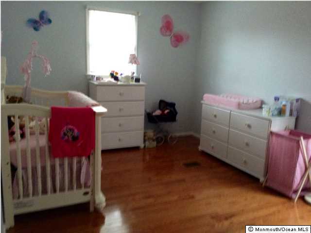 804 Allaire Road Spring Lake Heights, NJ 07762 - Photo 8 of 9 a bedroom with a bed and a window