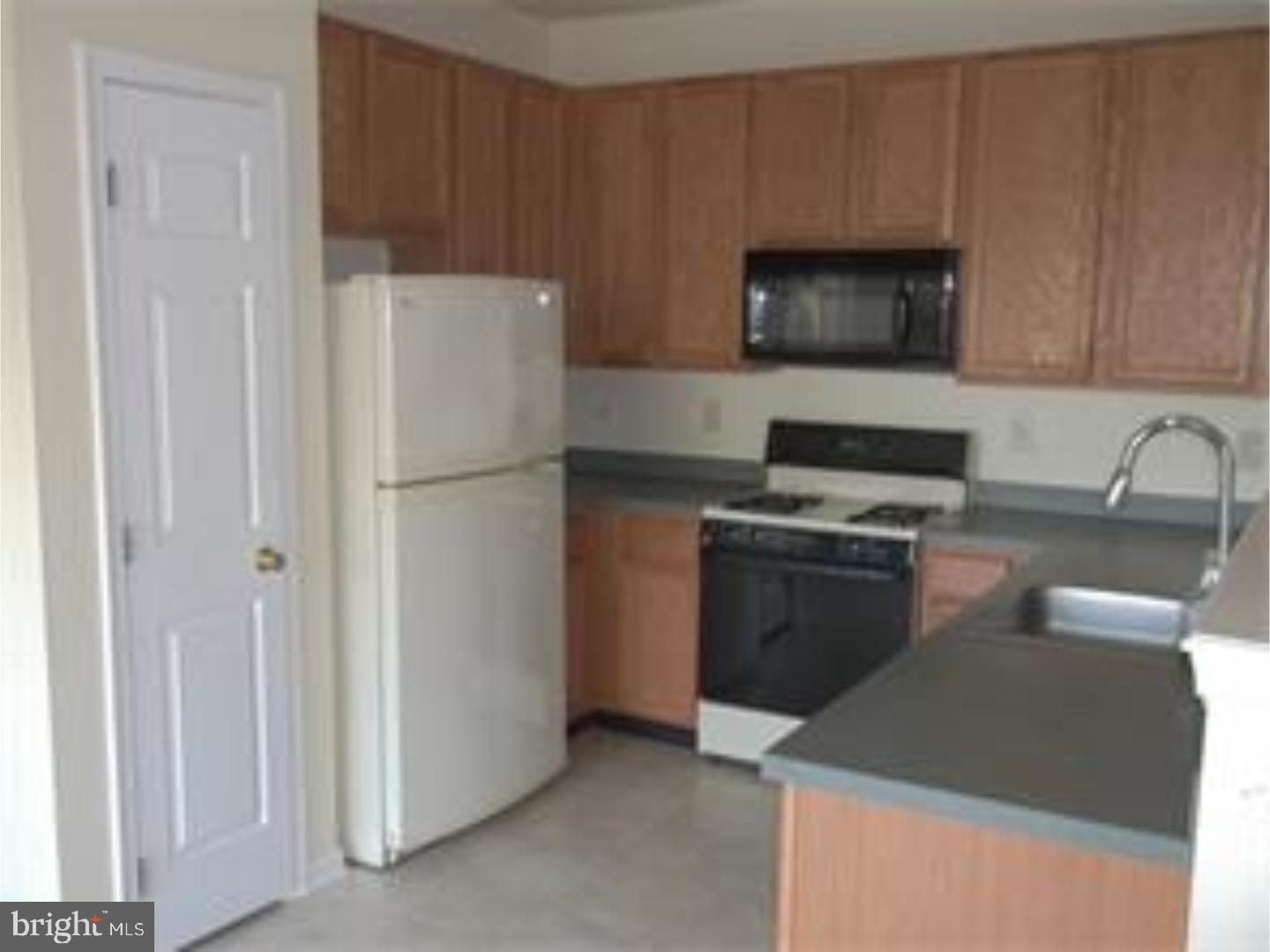 80 Threadleaf Terrace Burlington, NJ 08016 - Photo 5 of 19 a kitchen with a refrigerator stove and microwave