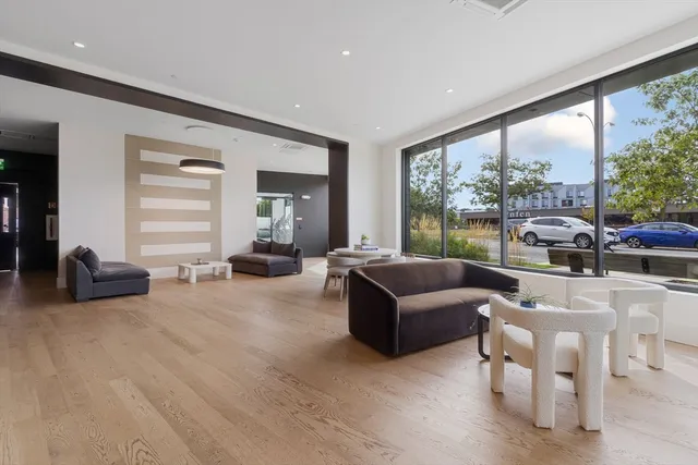 a room with gym equipment and windows