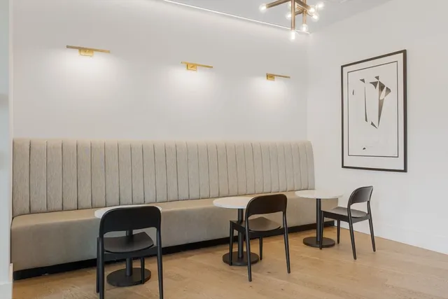 a view of a dining room with furniture and window