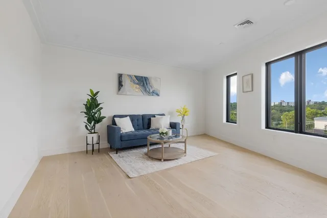 a view of a livingroom with furniture and window