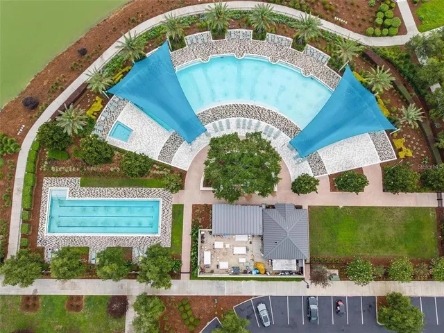 a view of a swimming pool with a yard