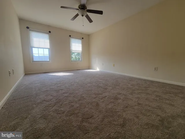 an empty room with a windows