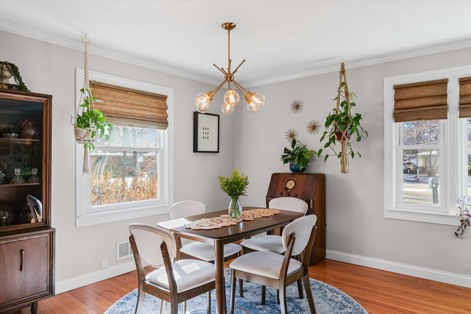 11 Normandy Place Champaign, IL 61821 - Photo 13 of 37 a dining room with furniture potted plants and wooden floor