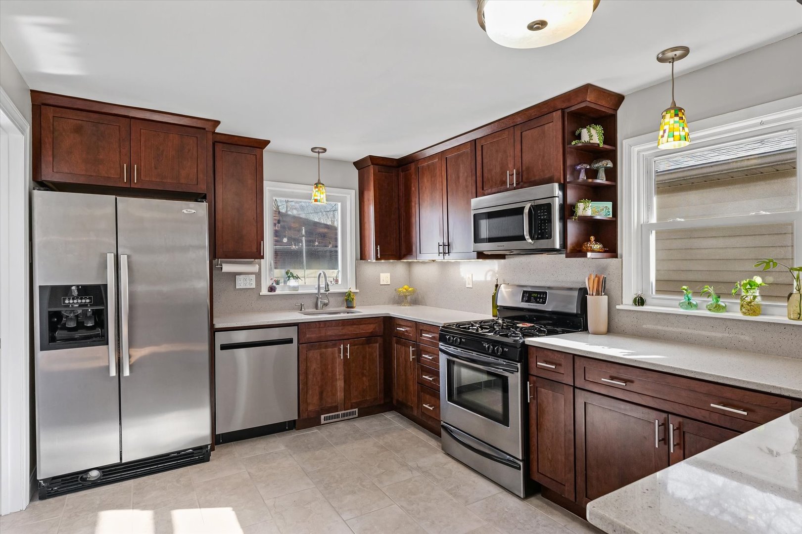 11 Normandy Place Champaign, IL 61821 - Photo 15 of 37 a kitchen with stainless steel appliances granite countertop a refrigerator microwave and sink