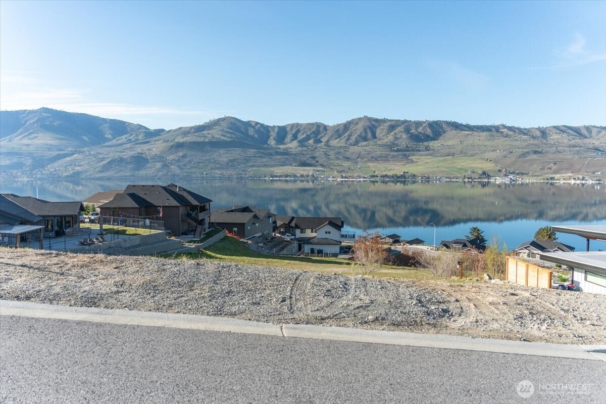 256 Apple Avenue Chelan, WA 98816 - Photo 12 of 18 a view of a house with a yard and sitting area
