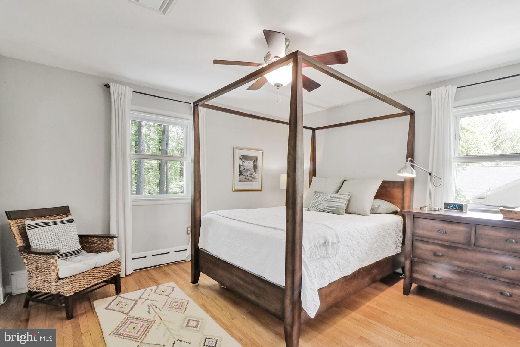 3419 Barkley Drive Fairfax, VA 22031 - Photo 17 of 57 a bedroom with a bed a chandelier and a dresser