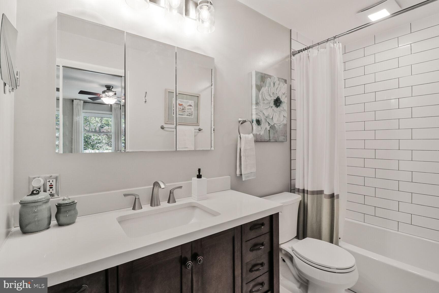 3419 Barkley Drive Fairfax, VA 22031 - Photo 23 of 57 a bathroom with a sink a toilet and shower
