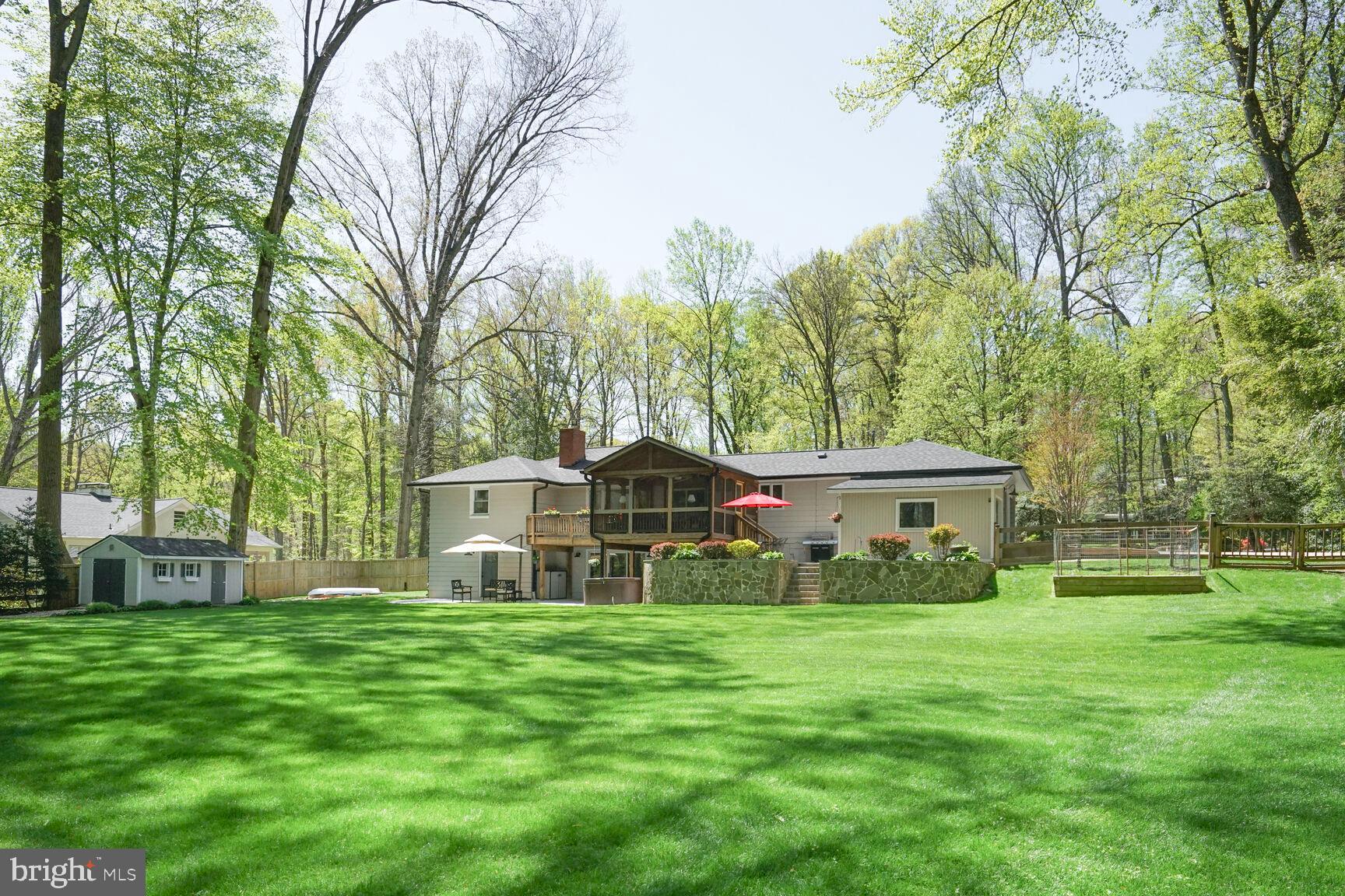 3419 Barkley Drive Fairfax, VA 22031 - Photo 48 of 57 a front view of a house with garden and trees