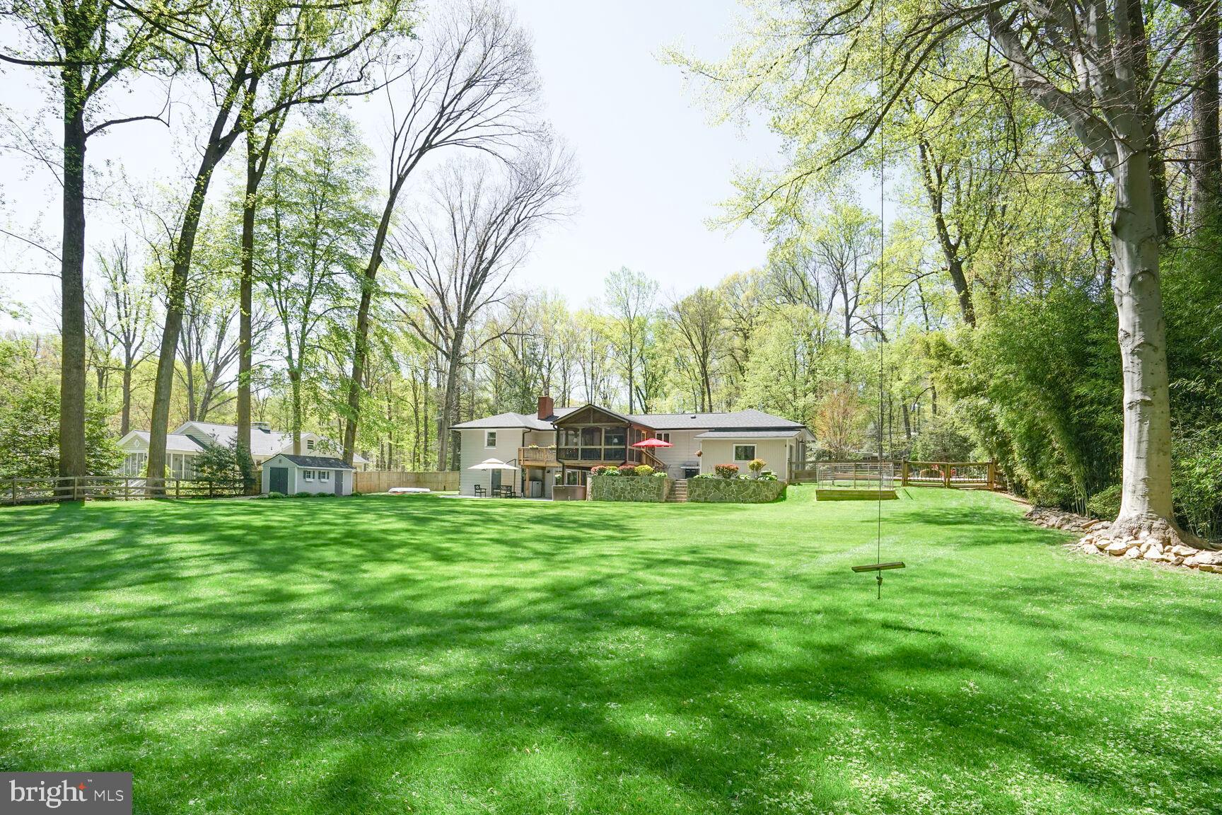 3419 Barkley Drive Fairfax, VA 22031 - Photo 51 of 57 a backyard of a house with table and chairs