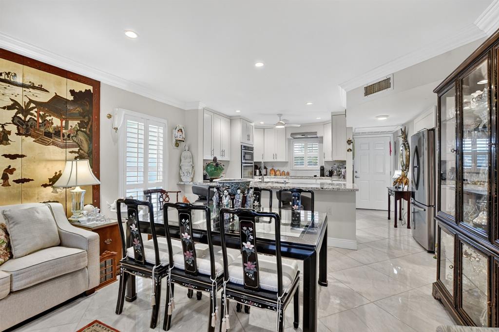 250 Northeast 20th Street, Unit 2270 Boca Raton, FL 33431 - Photo 12 of 39 a dining room with furniture and large window