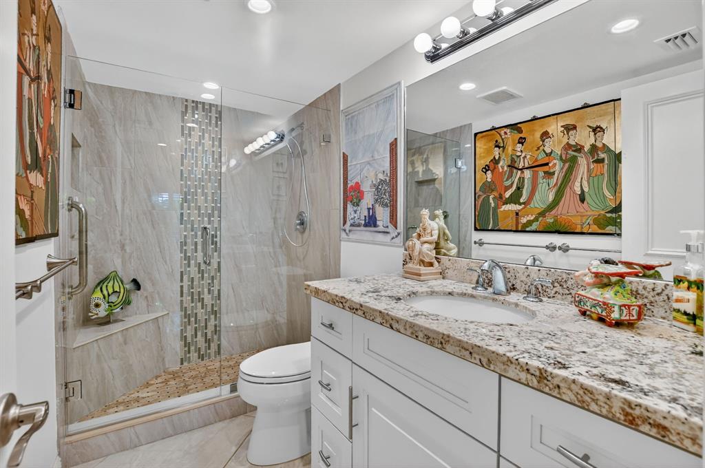 250 Northeast 20th Street, Unit 2270 Boca Raton, FL 33431 - Photo 21 of 39 a bathroom with a granite countertop sink toilet and shower