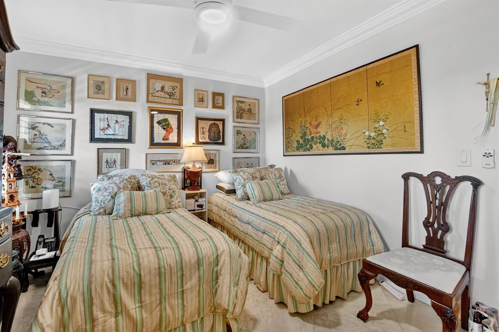 250 Northeast 20th Street, Unit 2270 Boca Raton, FL 33431 - Photo 24 of 39 a bedroom with a bed and painting on the wall