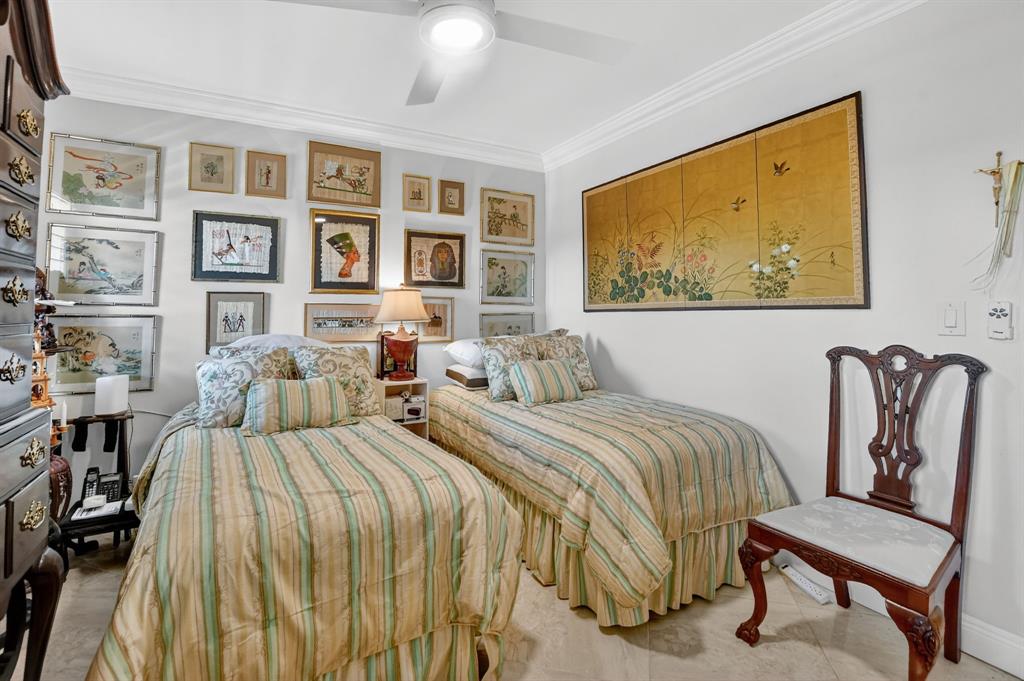 250 Northeast 20th Street, Unit 2270 Boca Raton, FL 33431 - Photo 25 of 39 a view of a bedroom with furniture and windows