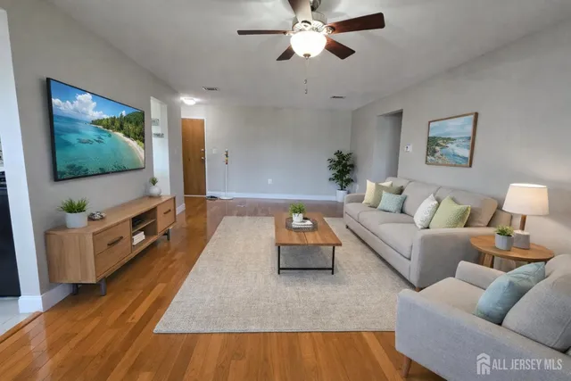 a living room with furniture and a flat screen tv