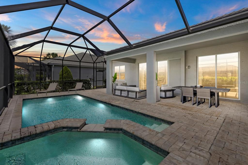 3508 Anchor Bay Trail Lakewood Ranch, FL 34211 - Photo 2 of 74 a view of a swimming pool with chairs