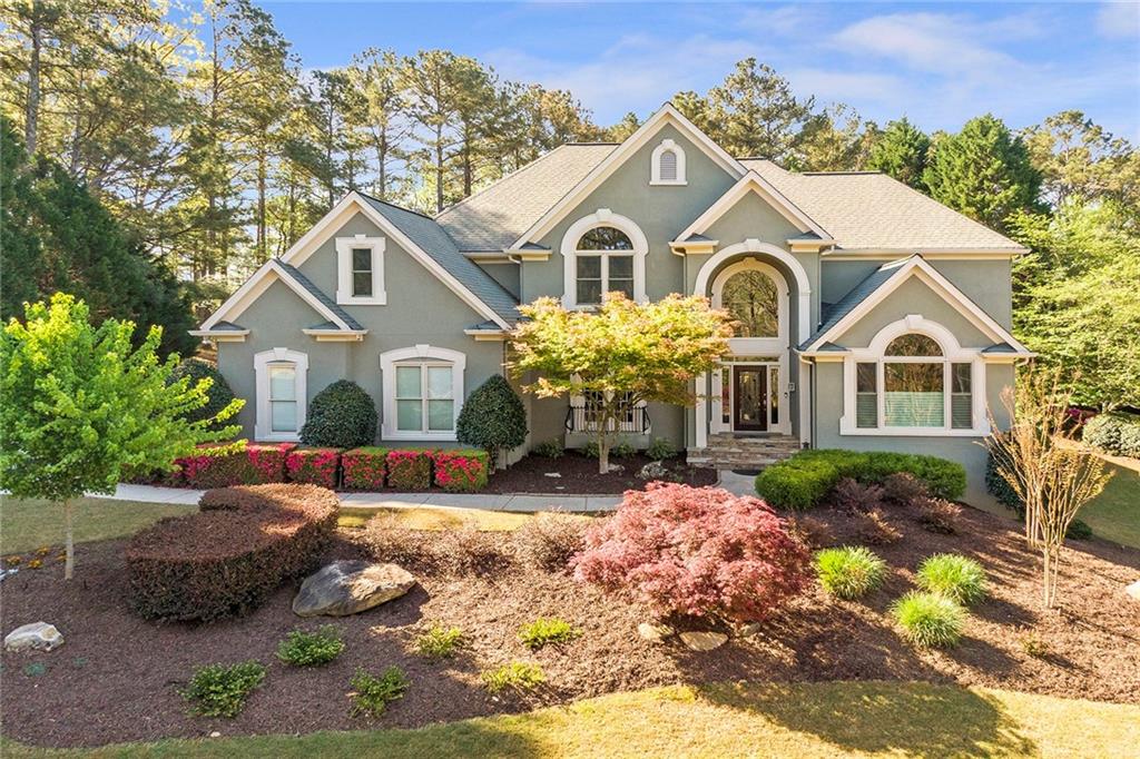 1010 Lake Shore Overlook Alpharetta, GA 30005 - Photo 1 of 1 a front view of a house with a yard