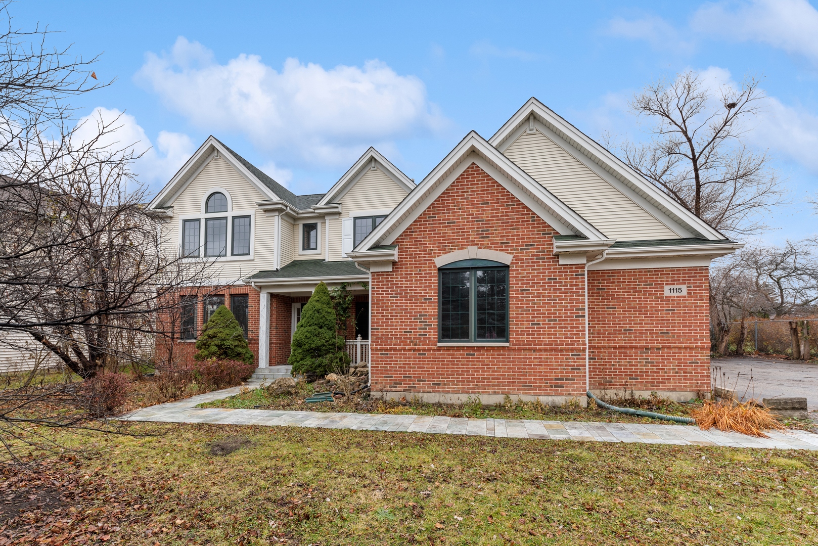 a front view of a house with a yard