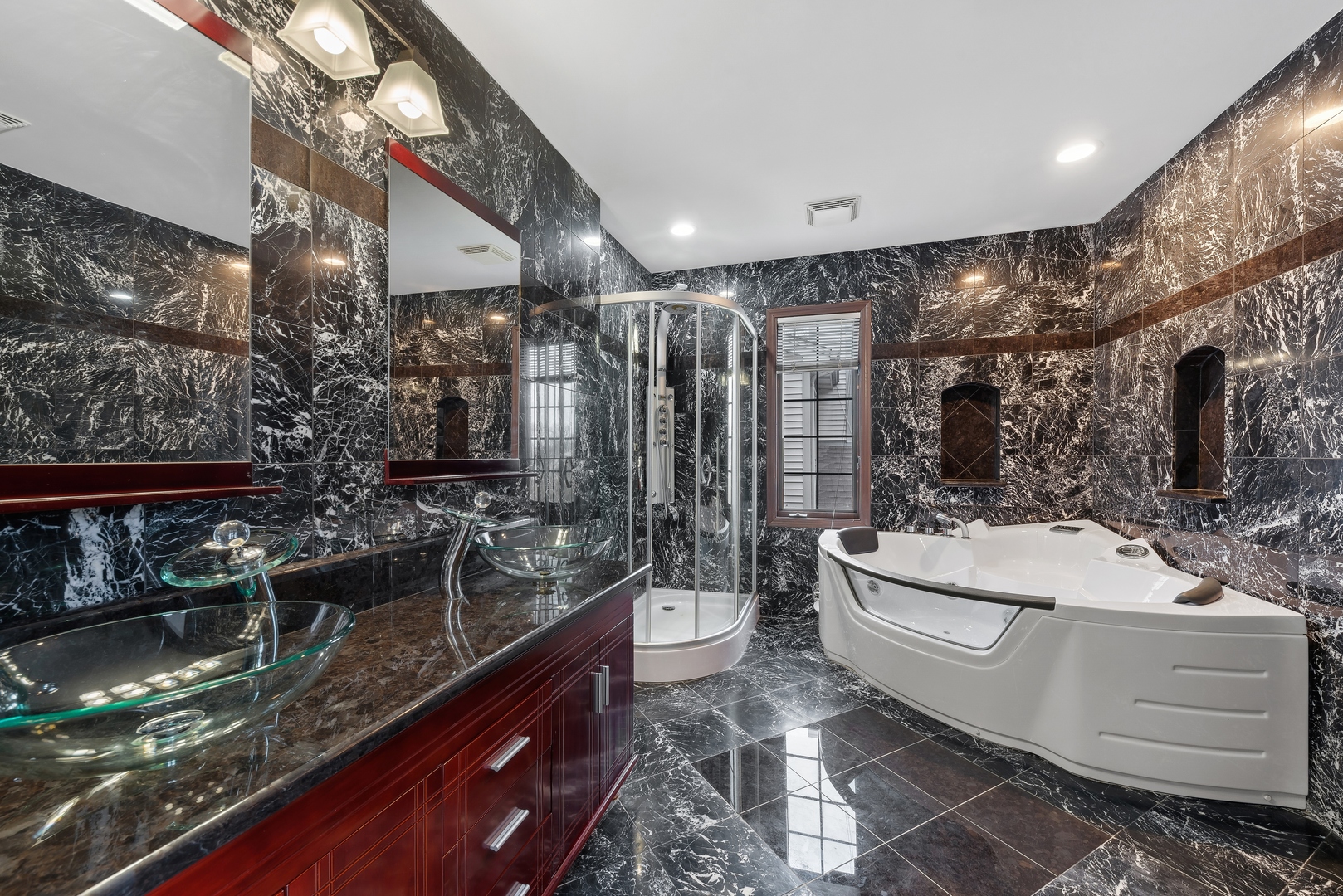 1115 South Elmhurst Road Wheeling, IL 60090 - Photo 18 of 33 a bathroom with a double vanity sink a toilet a mirror and shower