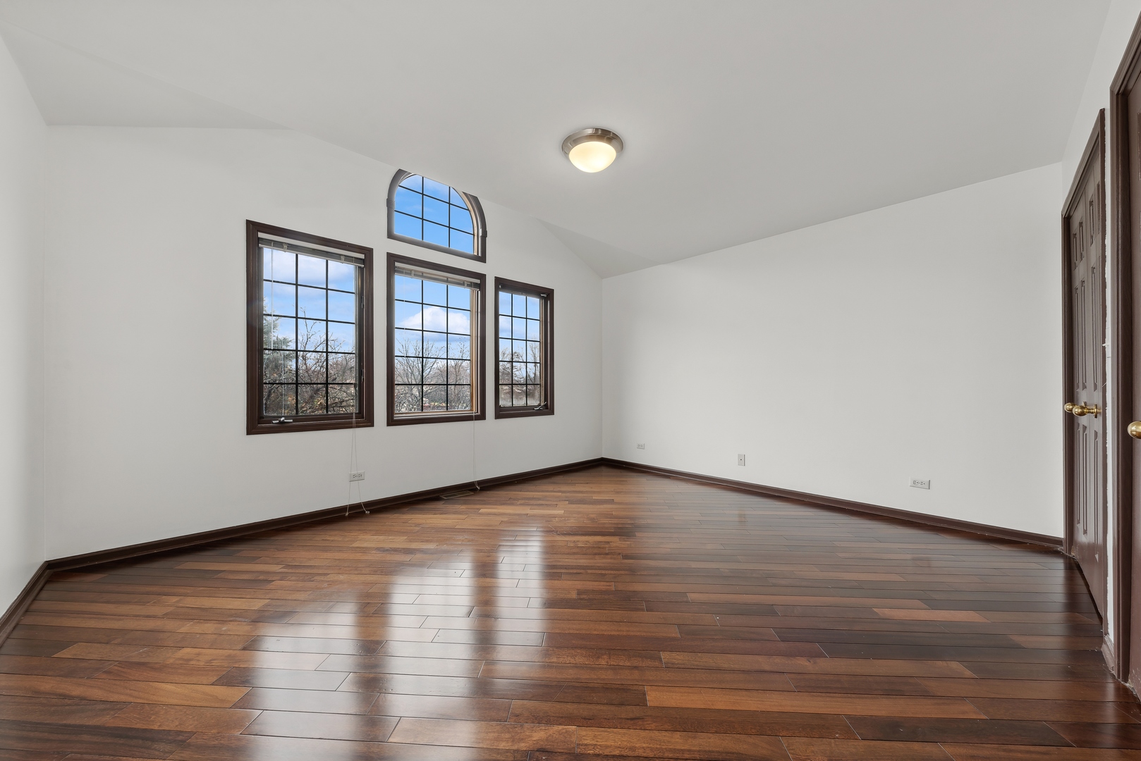 1115 South Elmhurst Road Wheeling, IL 60090 - Photo 19 of 33 a view of an empty room with wooden floor and a window