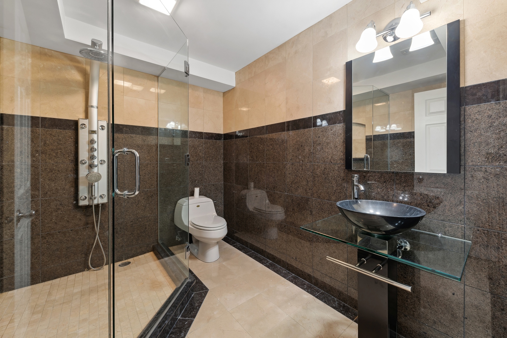 1115 South Elmhurst Road Wheeling, IL 60090 - Photo 23 of 33 a bathroom with a sink a toilet and shower