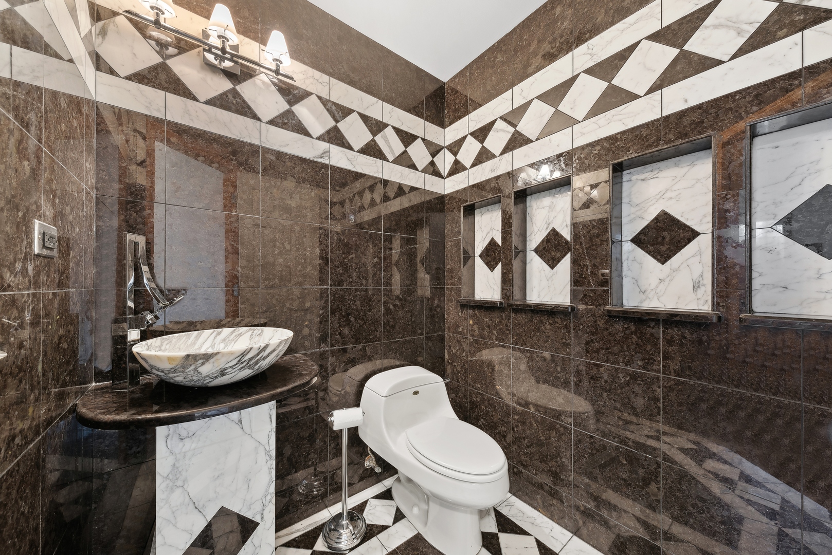 1115 South Elmhurst Road Wheeling, IL 60090 - Photo 28 of 33 a bathroom with a toilet sink and mirror