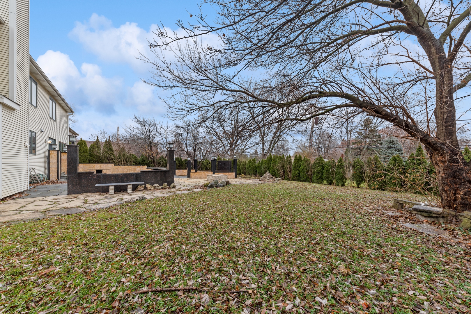 1115 South Elmhurst Road Wheeling, IL 60090 - Photo 32 of 33 a view of a yard with a house