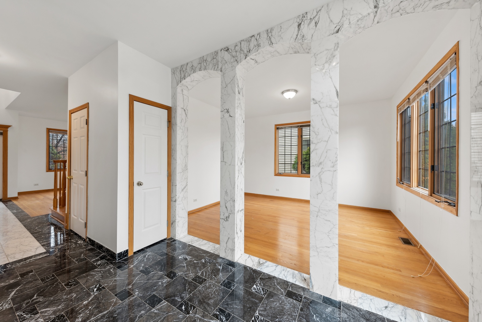 1115 South Elmhurst Road Wheeling, IL 60090 - Photo 10 of 33 a view of a hallway with wooden floor and entryway