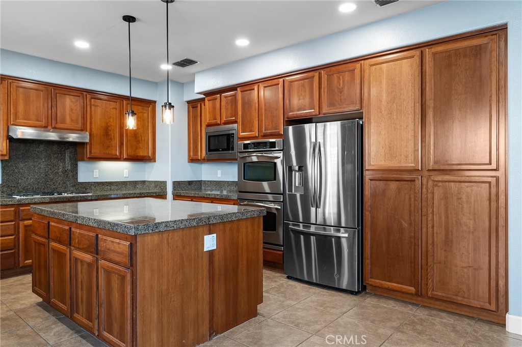 2010 Jacob Street Gridley, CA 95948 - Photo 17 of 63 a kitchen with stainless steel appliances granite countertop a refrigerator a sink and a stove