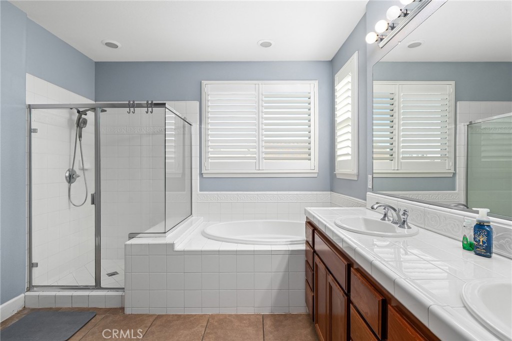 2010 Jacob Street Gridley, CA 95948 - Photo 40 of 63 a bathroom with a granite countertop shower sink and a bathtub