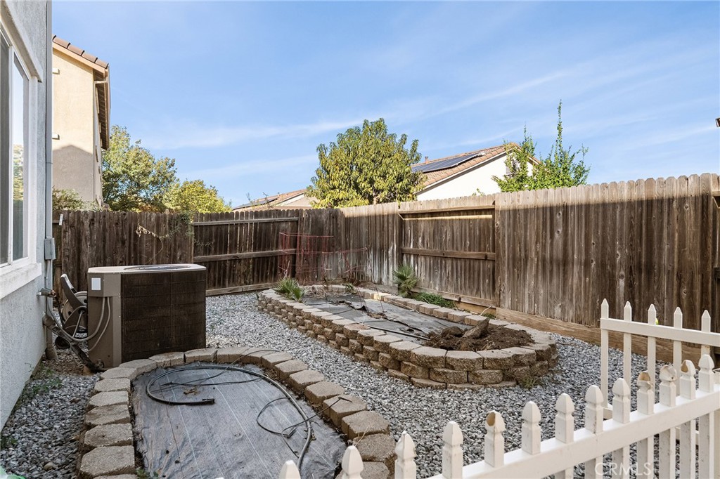 2010 Jacob Street Gridley, CA 95948 - Photo 46 of 63 a view of a backyard with table and chairs with wooden fence