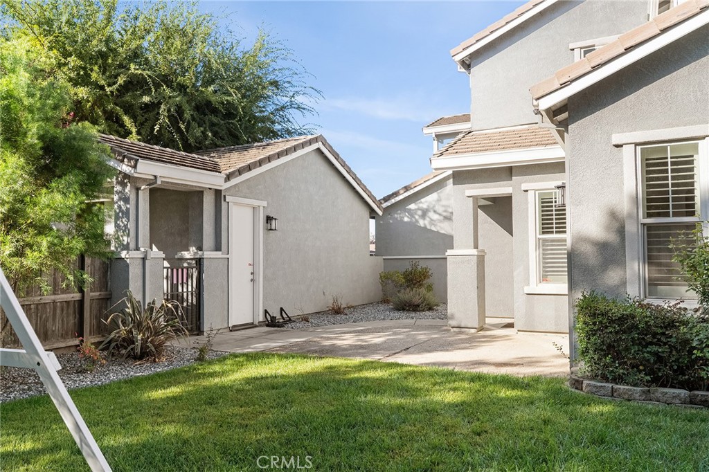 2010 Jacob Street Gridley, CA 95948 - Photo 49 of 63 a view of a house with a yard and potted plants