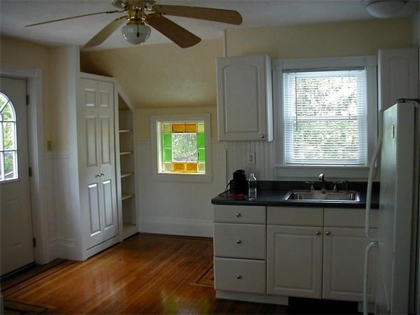 49 Dean Avenue, Unit 2 Franklin, MA 02038 - Photo 2 of 9 a kitchen with a sink and cabinets