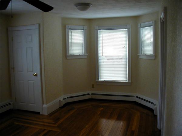 49 Dean Avenue, Unit 2 Franklin, MA 02038 - Photo 4 of 9 a view of a hardwood floor in a room