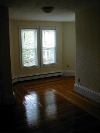 49 Dean Avenue, Unit 2 Franklin, MA 02038 - Photo 5 of 9 a view of empty room with wooden floor and fan