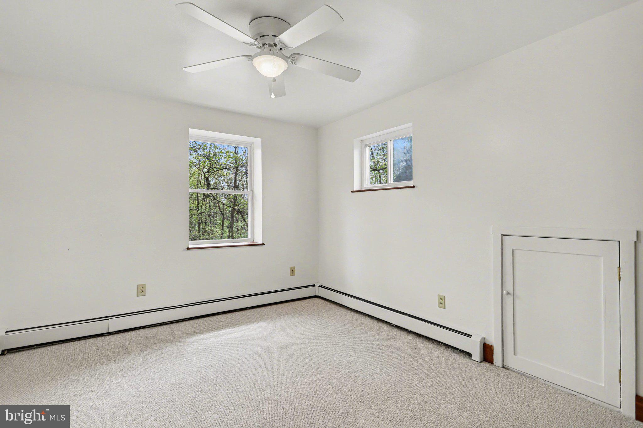 204 Bullfrog Road Gettysburg, PA 17325 - Photo 28 of 52 an empty room with a window and a fan
